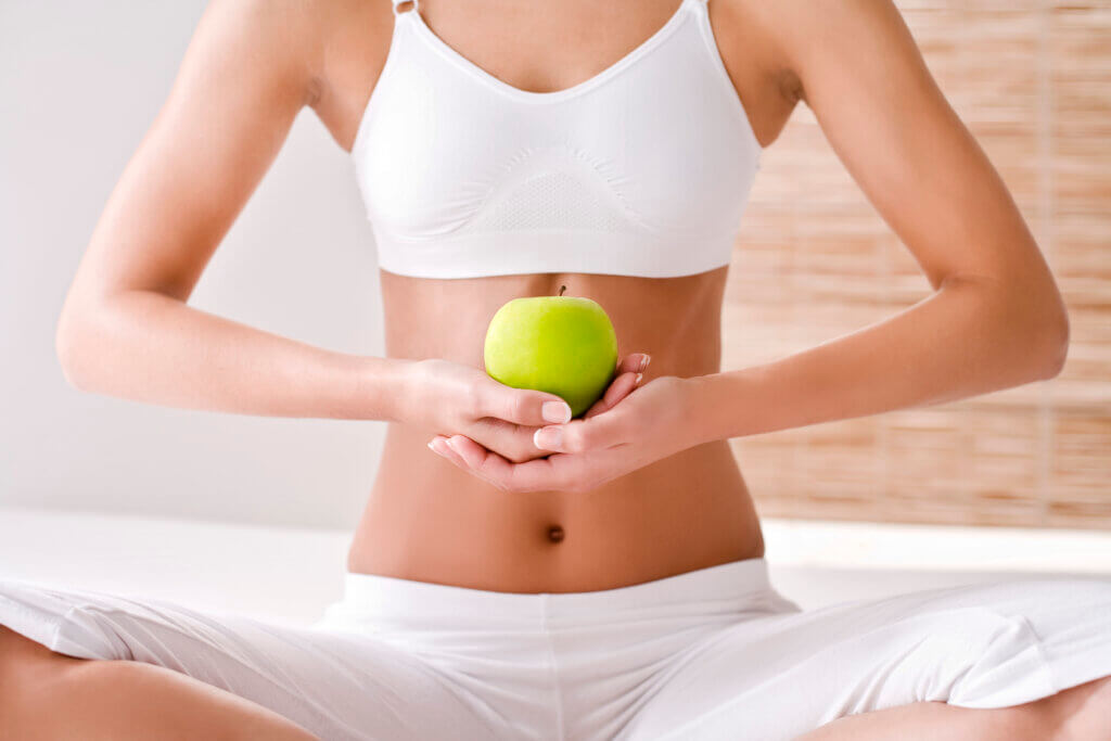 woman holding an apple close up 2024 09 18 19 46 42 utc